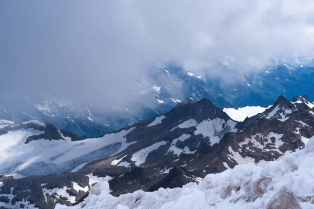 istock mountain landscape, rocks and glaciers among clouds 2167040388