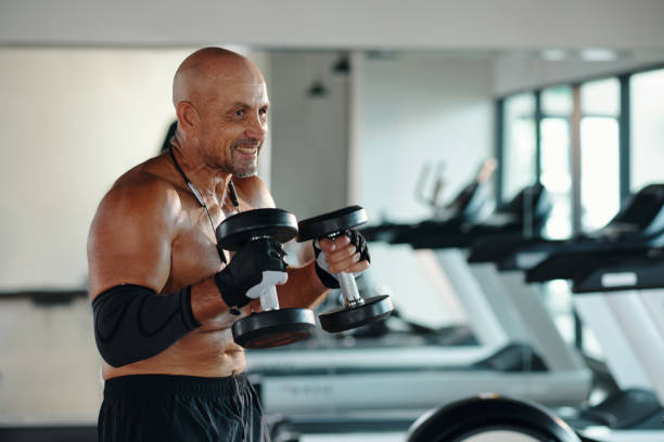 istock Muscular Man Exercising With Dumbbells 2167041040