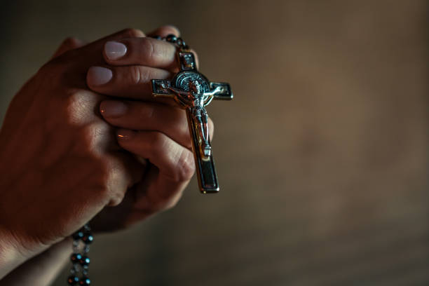 istock Female Hands Holding Crucifix 2167042166