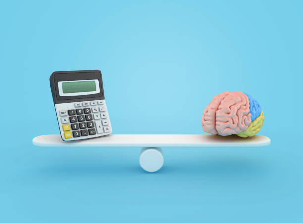 istock 3D Calculator on Seesaw with Brain 2167042578