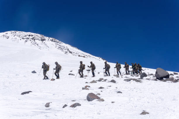 Elbrus, Russia - August 02, 2024: mountain troops undergo training in highlands terrain