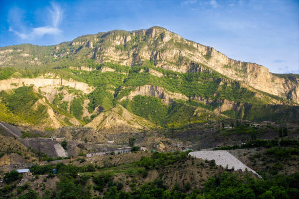 istock An industrial enterprise under a mountain. 2167046471