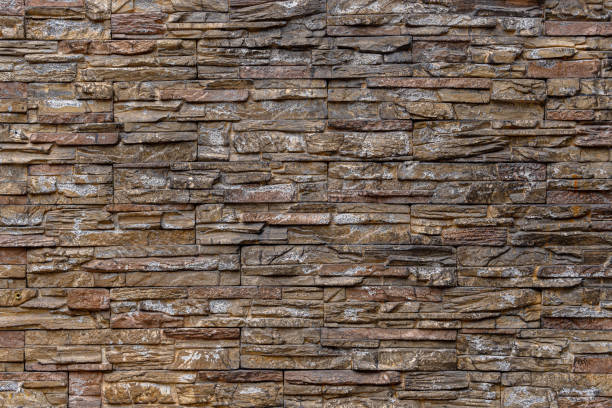 A wall made of brown  stones.