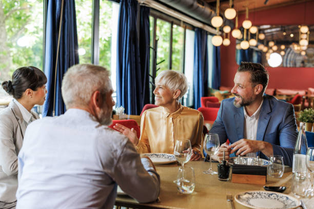 istock Businesspeople having a good time at a restaurant 2167048559