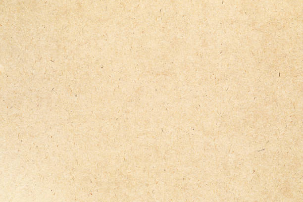 istock Macro grains kraft brown paper with scratches texture 2167049475