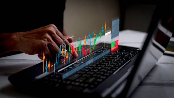 istock Businessman analyzes financial data on stock exchange trading graphs. Forex trading chart digital assets financial business technology investment concept. 2167055077