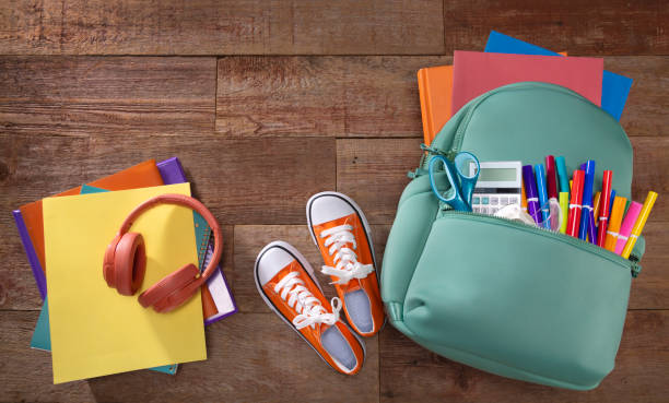 istock Back to School Backpack with Supplies on a Wood Background 2167057532