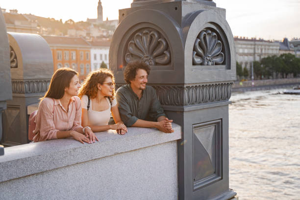 istock Friends enjoying sunset views over the Danube River in Budapest 2167059565