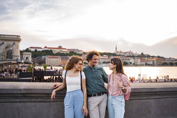 istock Friends enjoying a sunset by the Danube River in Budapest 2167059920