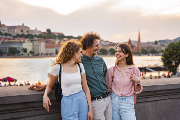 istock Friends enjoying the sunset along the Danube River in Budapest 2167059993