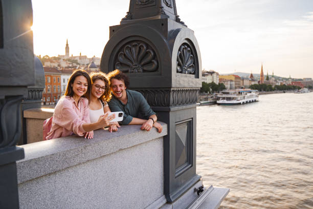 istock Friends taking a selfie on a bridge in Budapest during sunset 2167060029