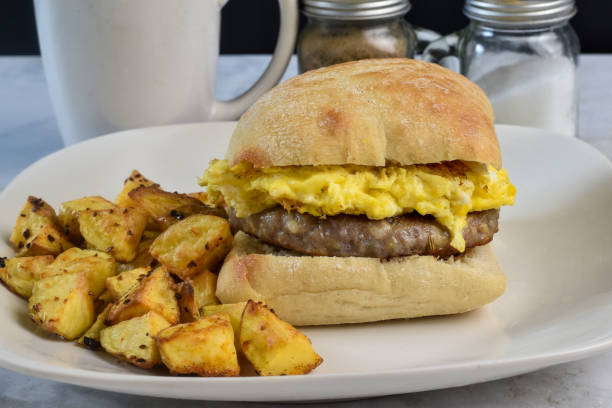 istock scramble egg and sausage patty breakfast sandwich, 2167061847