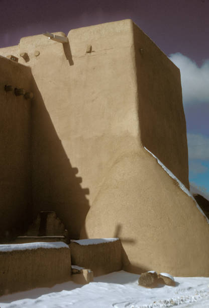 Taos, NM, USA - June 25, 2019: Tourists visit  the historic Taos Pueblo. The structure was originally built sometime between the year 1000 and 1450.