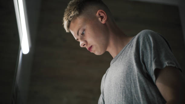istock Boy comes to sink in bathroom, washes face with cold water 2167063548