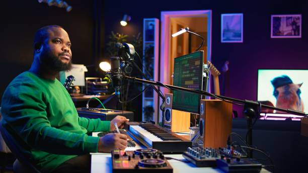 istock Composer writes verses and ideas to develop original song in home studio 2167065573