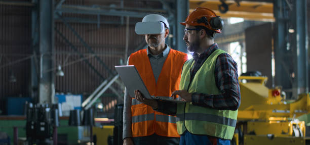 istock Mature engineer uses VR headset, adult employee work in laptop 2167066949