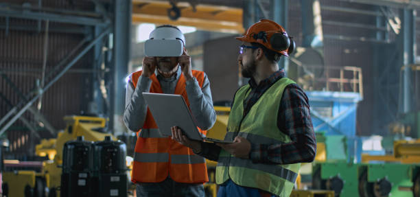 istock Mature engineer uses VR headset, adult employee work in laptop 2167067048
