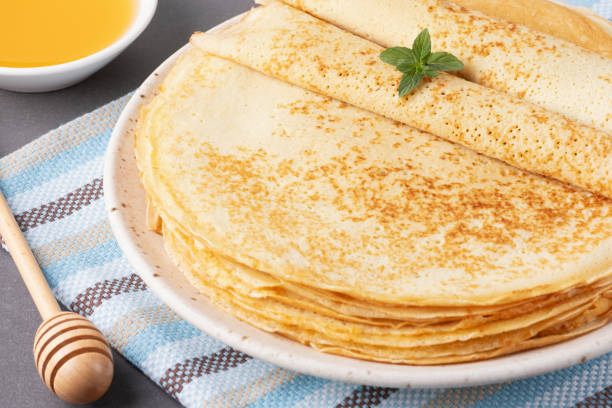 istock Stack of traditional russian pancakes blini on gray background with copy space. Homemade russian thin pancakes blini. Russian food, russian kitchen 2167068897