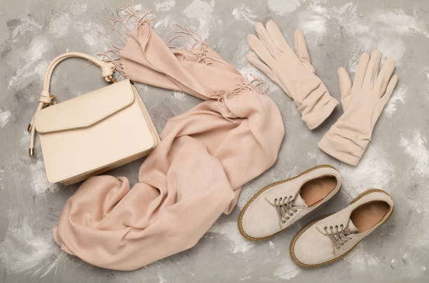 istock Stylish autumn accessories on concrete background, top view 2167074998