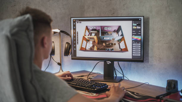 istock Caucasian teenager creates and develops stylish house interior using computer 2167076267