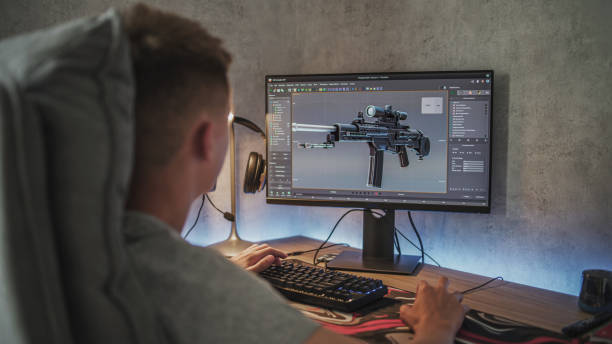 istock Caucasian teenager creates 3D model of sniper rifle using computer 2167076552