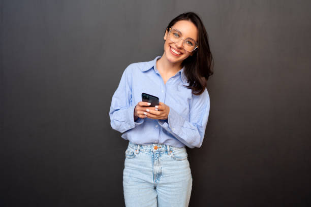 istock Woman use smartphone isolated on black 2167079489