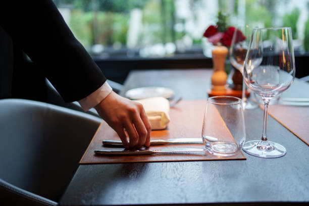 istock Close-up of hands placing cutlery 2167080705