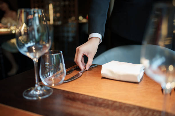 istock Close-up of hands placing cutlery 2167080708
