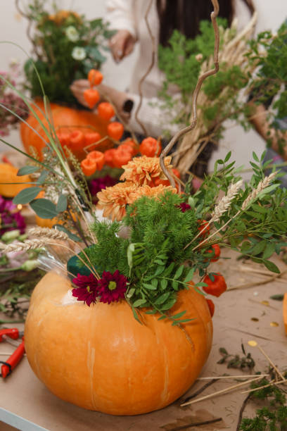 istock Creating a floral composition in a pumpkin. Making decor with your own hands. 2167083919