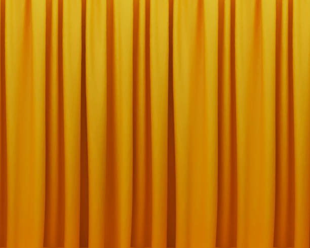 istock Golden curtain texture abstract background with yellow and orange shades. Modern curtain backdrop 2167084869