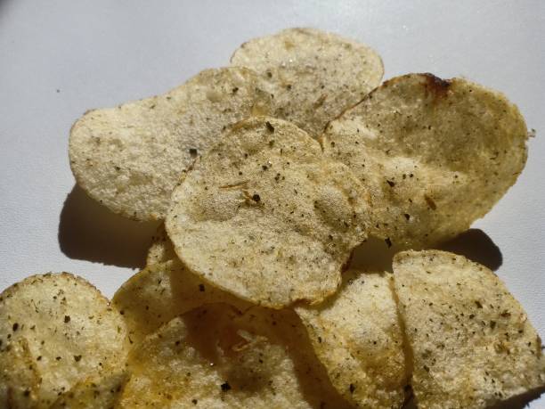 istock Crispy potatoes seasoned with spices on a white background 2167084946