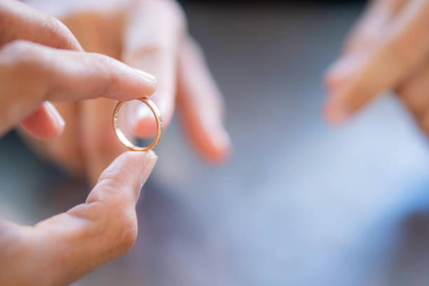 istock Close-Up of a Hand Holding a Gold Ring 2167086750