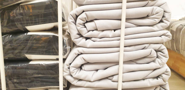 istock bed linen on a rack in a store 2167090035