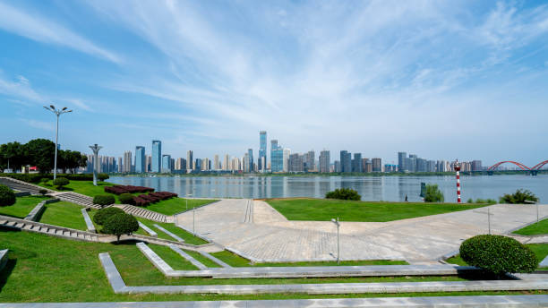istock Stunning Waterfront Cityscape with Modern Architecture and Lush Landscapes 2167090403