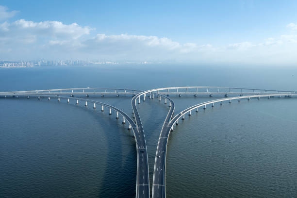 istock Aerial View of a Modern Bridge Intersecting Over Water 2167090961
