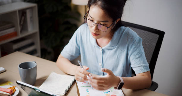 istock Young woman relaxing while having a video call on a laptop computer at home. 2167094246