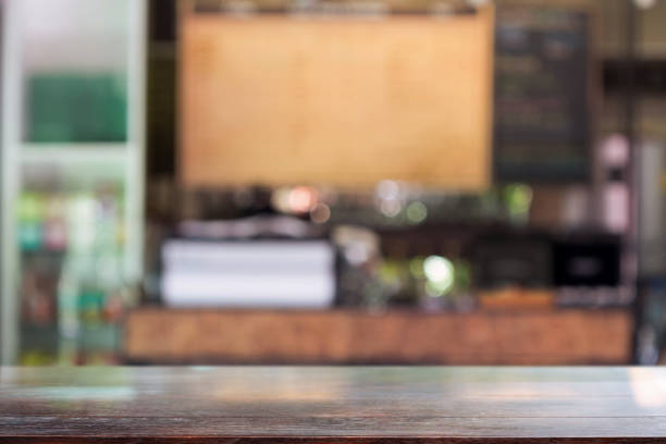 istock Wooden table with a blurred background coffee shop, space for product placement or text overlay 2167094639