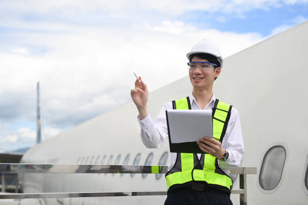 istock Professional aviation engineer using digital tablet on staircase or platform near the aircraft 2167094813