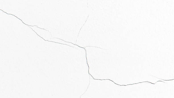 istock Dirty white cracked concrete wall texture background. 2167096940