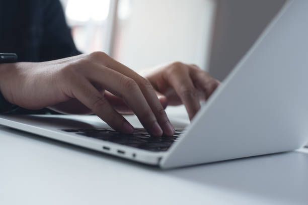 istock Business man working on laptop computer at home office, male hands typing on notebook keyboard, telecommuting, online job, working at home, portable office concept 2167097745