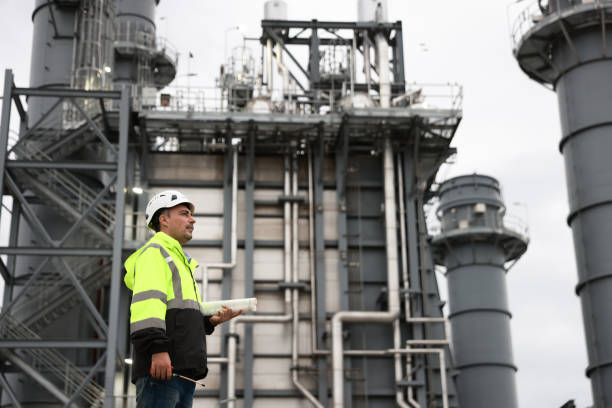 istock The project engineer inspects the pipe laying system. Worksite for building a medium-sized power plant in an industrial estate 2167108627