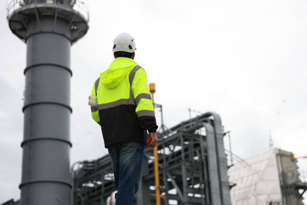 istock The project engineer inspects the pipe laying system. Worksite for building a medium-sized power plant in an industrial estate 2167108680