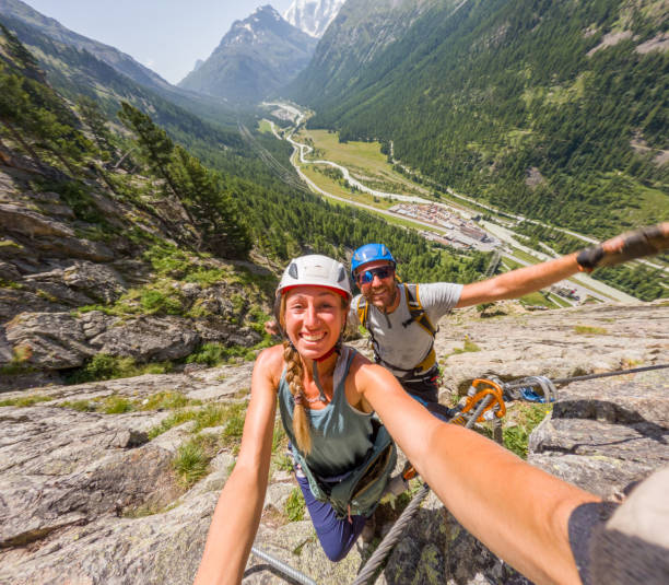 istock Two climbers taking fun selfie on Via ferrata 2167108817