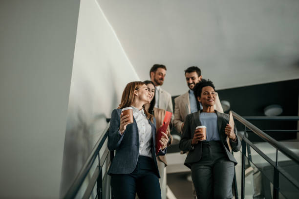 istock Business team walking through the office 2167109470