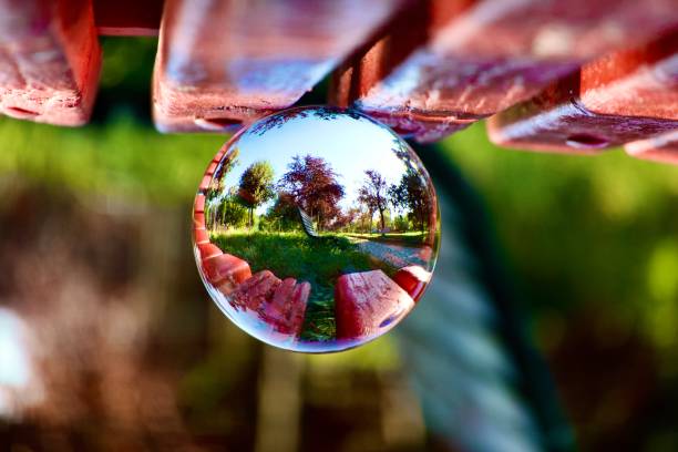Crystal ball on red wooden bench