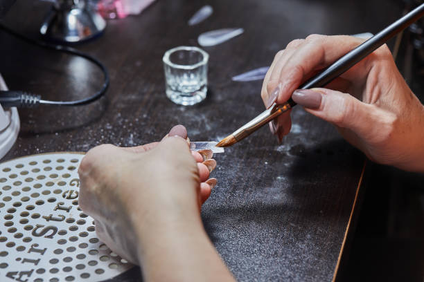 istock Nail Technician Applying Gel to Nail 2167118257