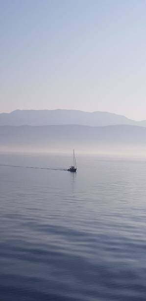 istock Timeless Blue-Hued Scene of a Boat Gliding Peacefully 2167121205