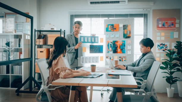 istock Corporate brainstorming session focusing on mobile product development. Captured in a modern office setting with emphasis on design strategy and teamwork. 2167122424