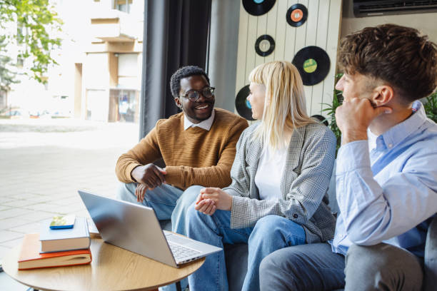 istock Diverse young coworkers chatting 2167122714