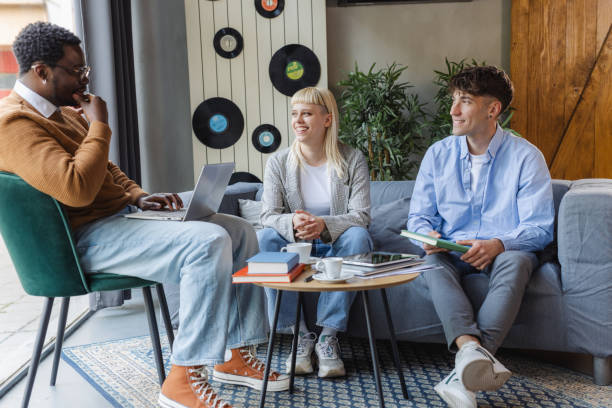 istock Diverse young coworkers chatting 2167122824